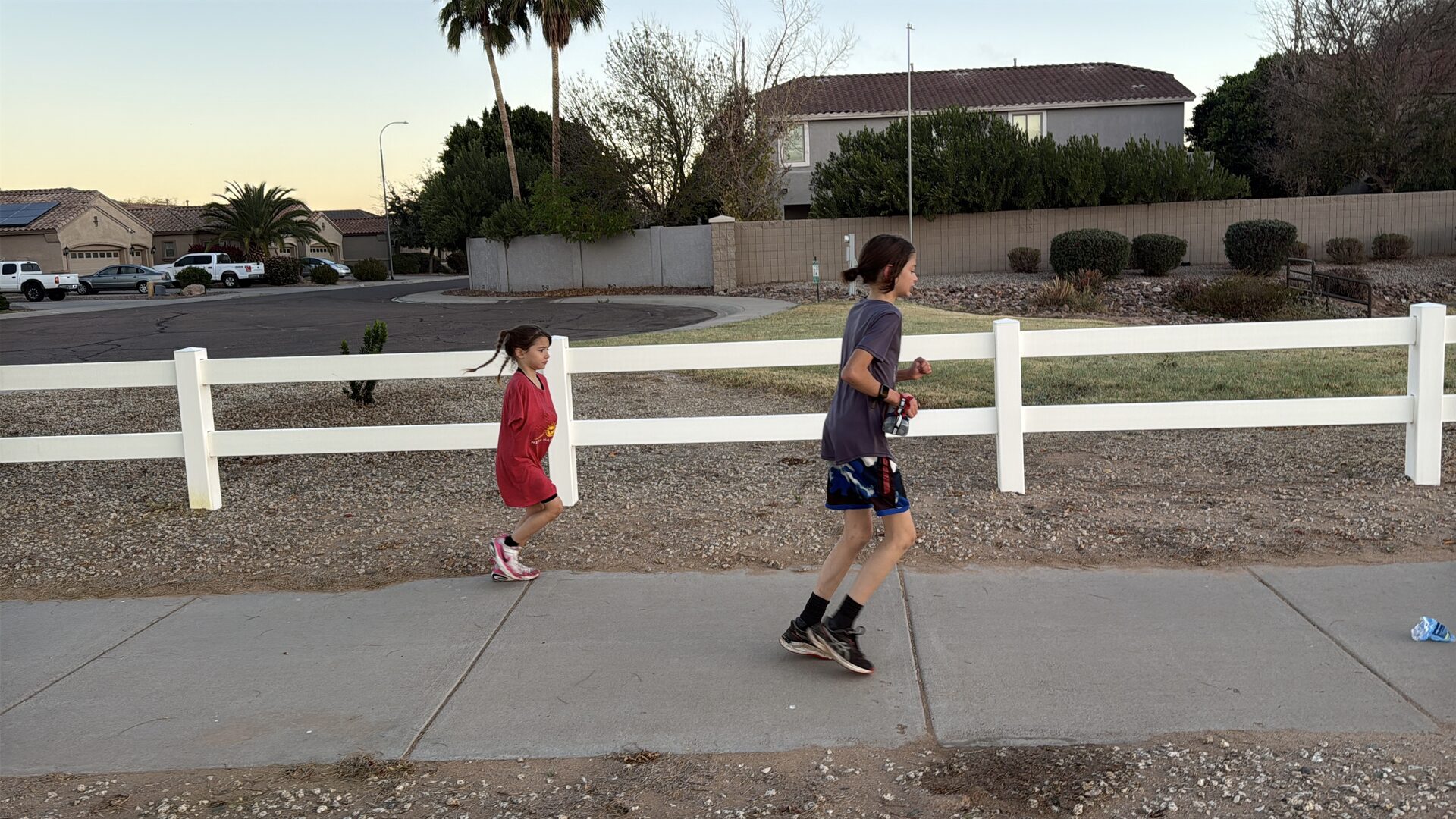 Sage and Asa pushing through the neighborhood streets in the final miles