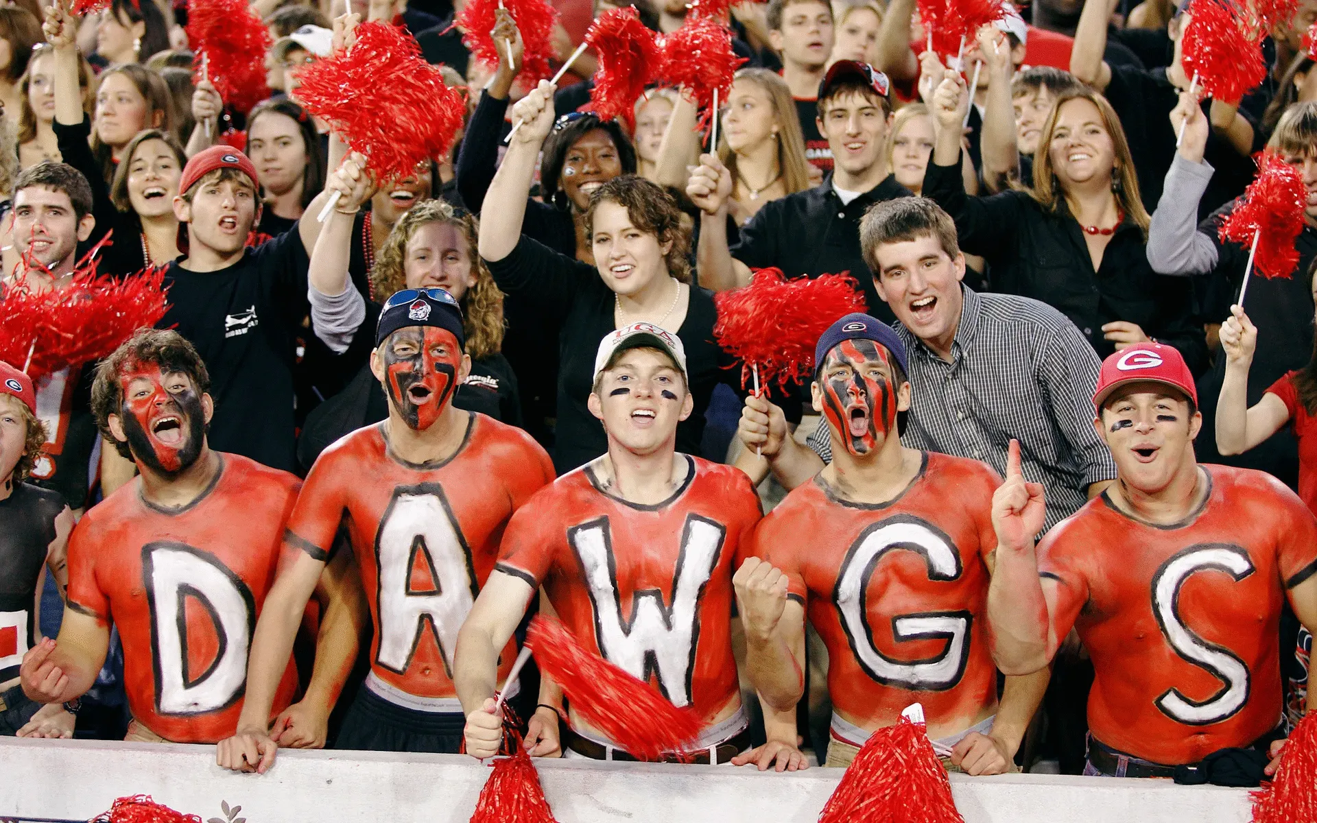 University of Georgia Bulldogs fans on game day — the kind of enrollment, athletics, and community energy that makes Power 4 student housing one of the most durable real estate assets available.